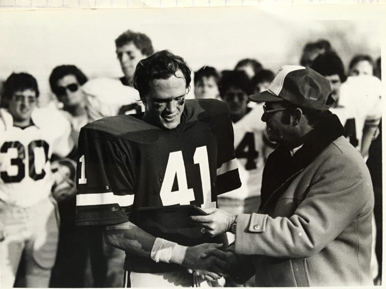 PT receiving the defensive award following the play-off, quarter final game against Pacific Lutheran in 1981